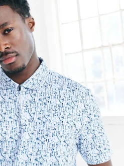 Next Blanc - Polo de golf à imprimé géométrique actif New