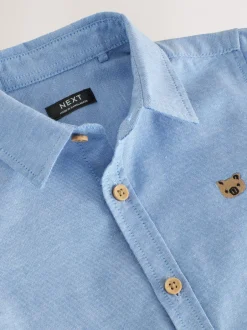 Next - Chemise Oxford à manches longues (3mths-7yrs) Bleu moyen motif personnage Outlet