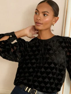 Love & Roses Coeur noir - Chemisier en tissu dévoré à manches longues et col rond Outlet