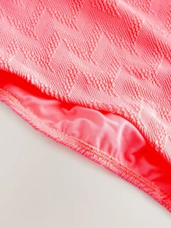 Next - Maillot de bain gainant à encolure dégagée Corail rose fluo texturé Clearance