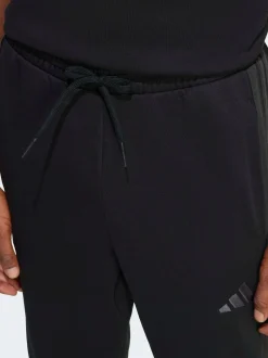 adidas Ground noires - Essentiels Pantalon de jogging polaire à rayures 3 Outlet