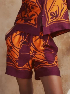 Next Imprimé bordures exotiques orange/bordeaux - Short de villégiature à taille élastique New