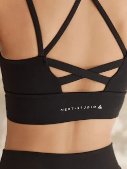 Next Noir - Soutien-gorge de sport à bretelles et dos à impact moyen New