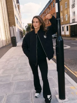 Never Fully Dressed Noir brodé - Leggings évasés en coton New