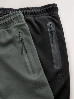 Next Noir/gris ardoise - Lot de 2 pantalons de jogging Interlock doux au toucher à chevilles Sale