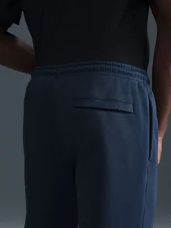 Nike Obsidienne - Pantalon de jogging Club en polaire coupe large Discount