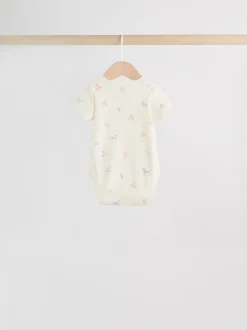 Next Personnage pastel multicolore - Lot de 7 bodies bébé à manches courtes New