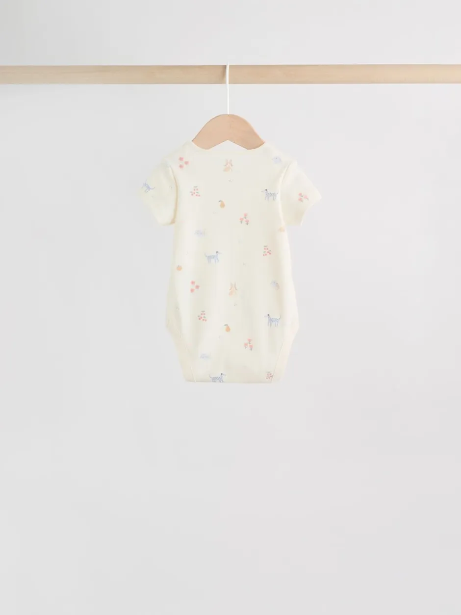 Next Personnage pastel multicolore - Lot de 7 bodies bébé à manches courtes New