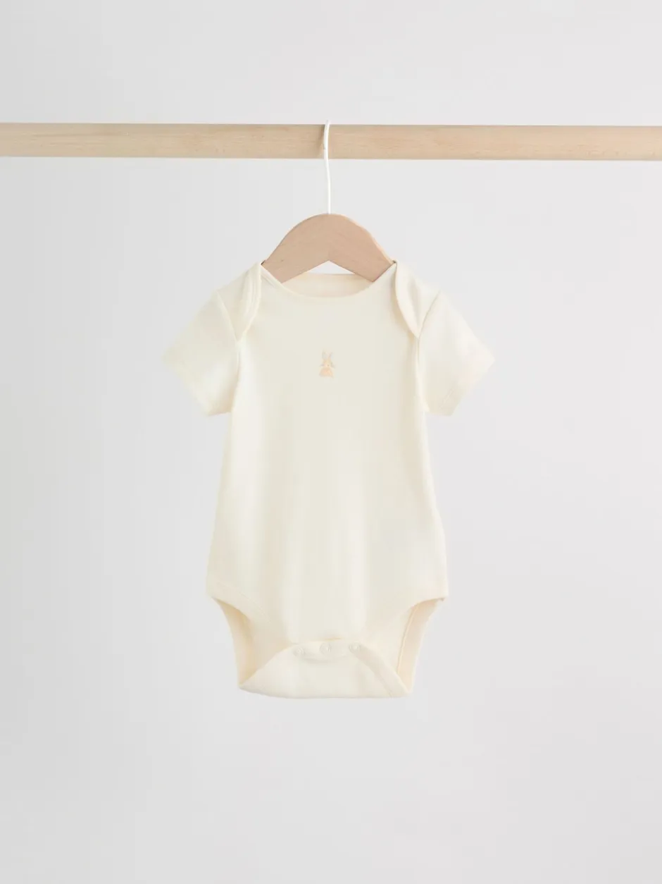 Next Personnage pastel multicolore - Lot de 7 bodies bébé à manches courtes New